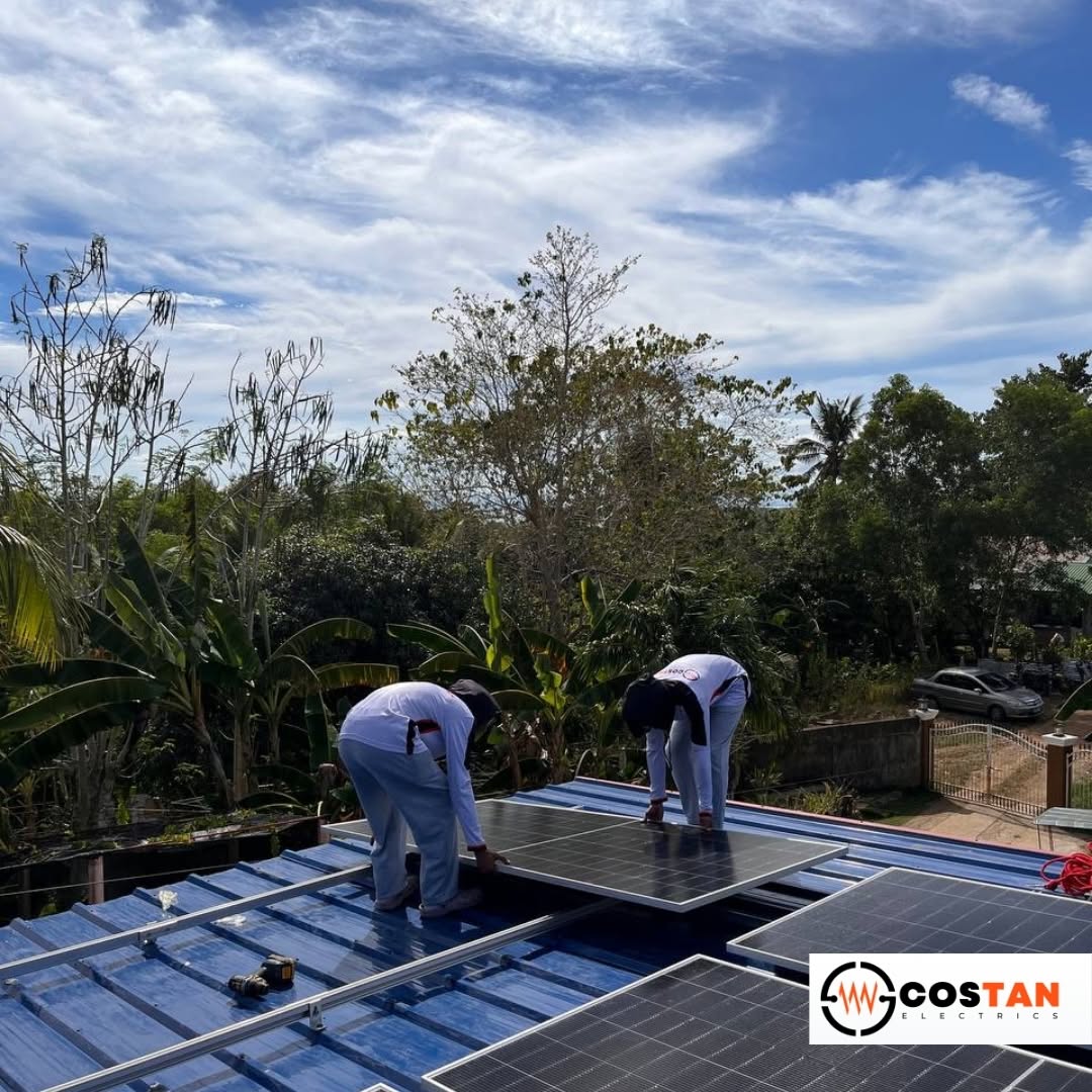 Costan Electrics technicians installing rooftop solar panels at a residence in San Jose, Getafe, Bohol