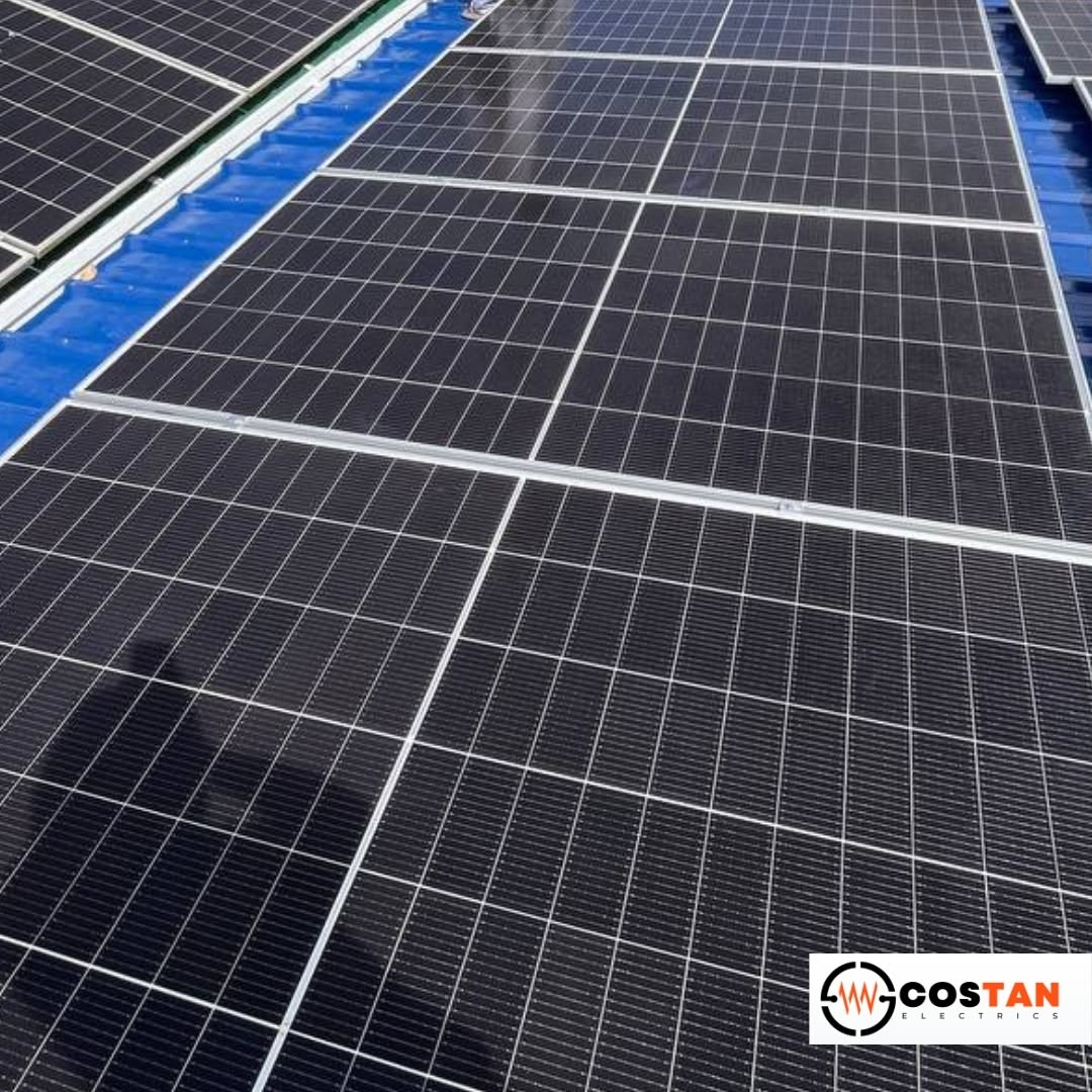 Close-up of monocrystalline solar panels installed on a metal roof by Costan Electrics in Getafe, Bohol
